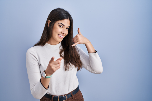 Young Woman Signalling Calling You 600X400